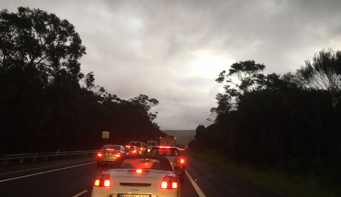 Car fire: Traffic is queued about two kilometres. Picture: Daniel Morgan.