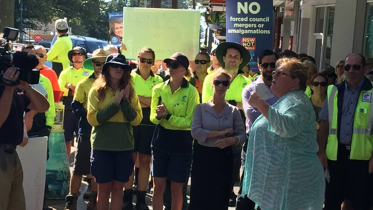 No merger: Shellharbour Mayor Marianne Saliba speaks to workers at Wednesday's rally at Kiama MP Gareth Ward's office. Picture: Brendan Crabb.