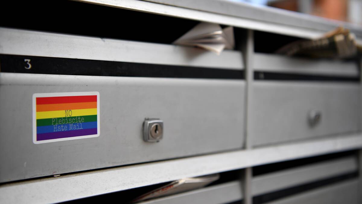 A sticker showing a message in support of a Yes vote in the marriage equality postal survey is seen on a mailbox. Image: Joel Carrett/AAP.