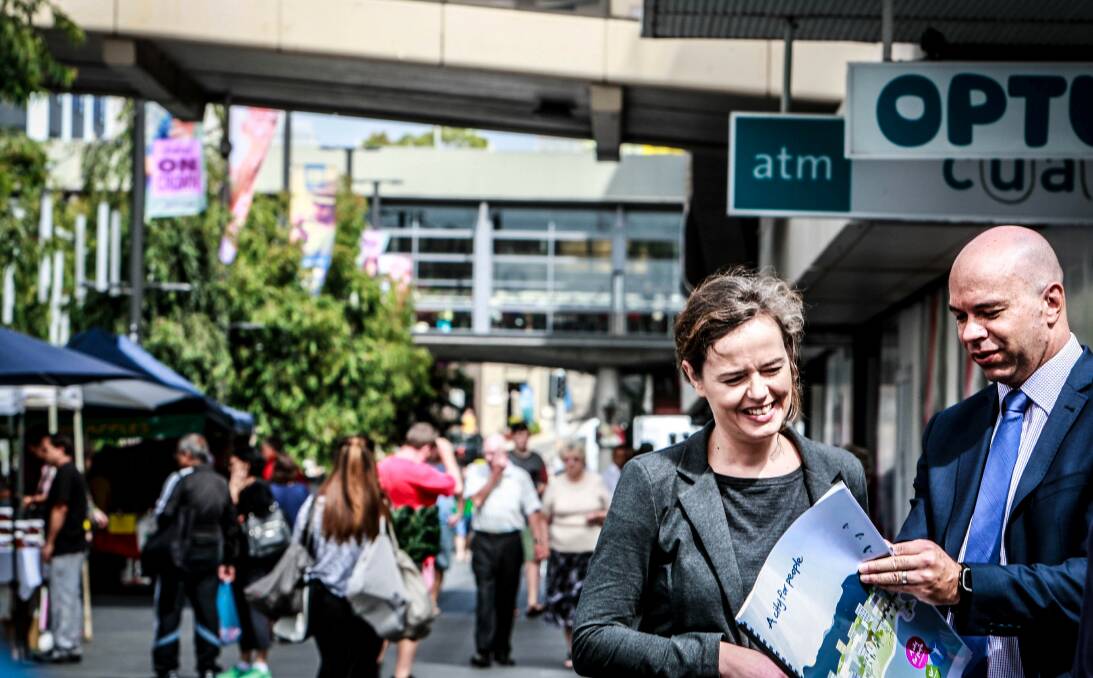 A changing city: Danish city expert Henriette Vamberg looks over Wollongong council's future plan with planning director Andrew Carfield in Crown Street Mall. Picture: Georgia Matts.