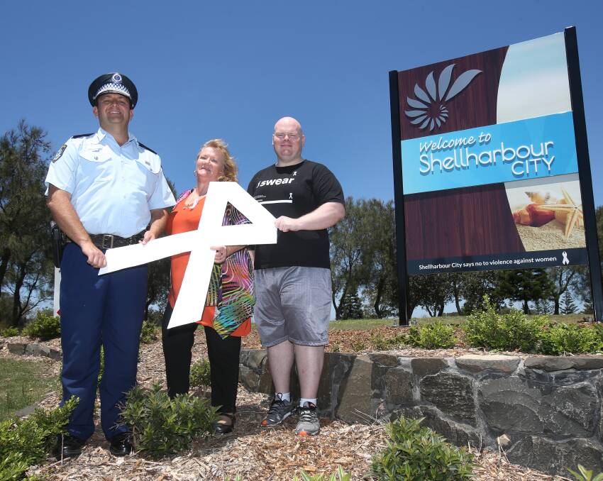A strong sign: Lake Illawarra Command's Jason Harrison, mayor Marianne Saliba and White Ribbon ambassador Kenton Bell. Picture: Robert Peet