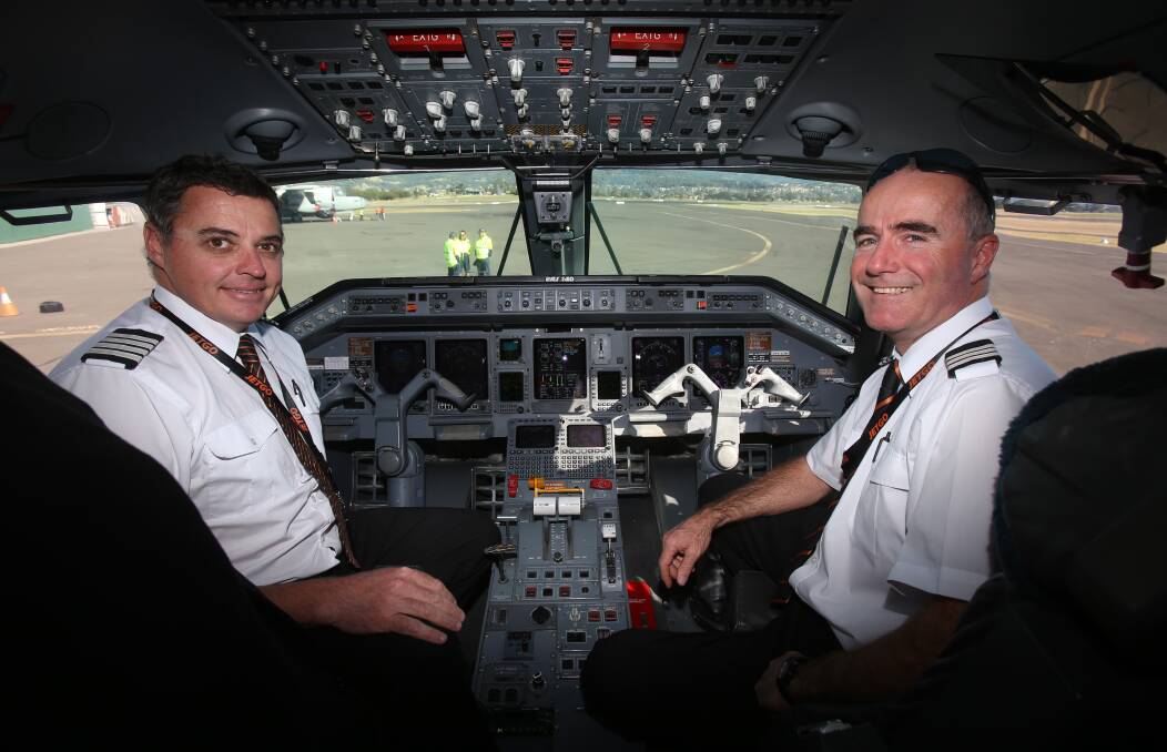 First journey: JetGo pilots Rodney McGuire and Neil Douglas at the Illawarra Regional Airport. Photos: Robert Peet.