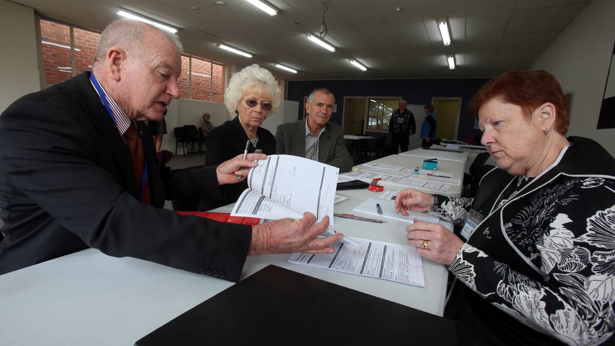 It's official: Gordon Bradbery, Terry Gallagher and Dom Figliomeni with Wollongong City Council returning officer Judith Frost. Picture: Robert Peet