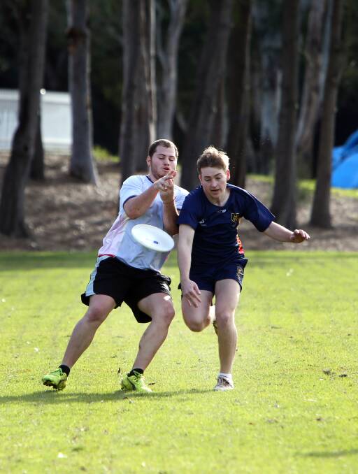 A flying start: Reece Matheson and Danien Makeham play ultimate frisbee at the Eastern University Games. Picture: Sylvia Liber.