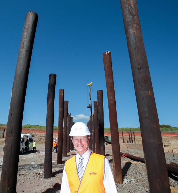 Going up: Shell Cove development director Glenn Colquhoun, with the development of the marina wall where large pylons are now being inserted. Pictures: Adam McLean.