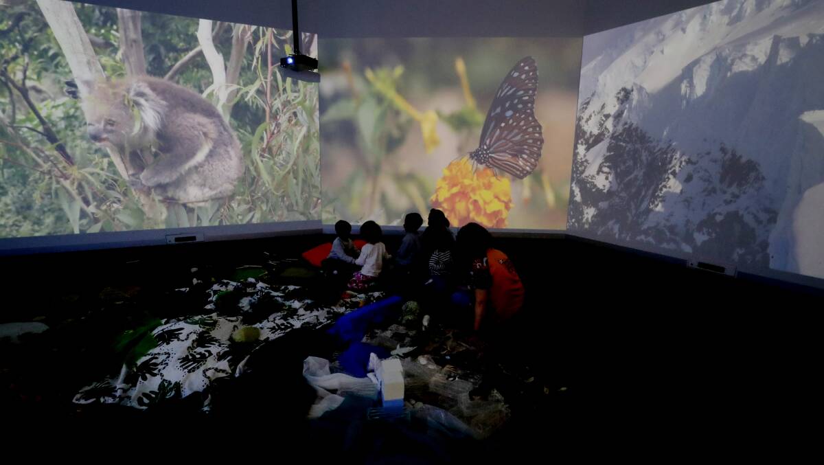 Kids take part in an immersive geography exhibit at Early Start. Picture by Robert Peet
