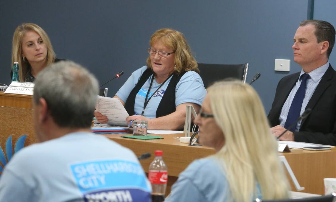 The fight goes on: Mayor Marianne Saliba moves a motion which will let the council's lawyers fight the merger in the courts "to the fullest extent". Picture: Robert Peet.
