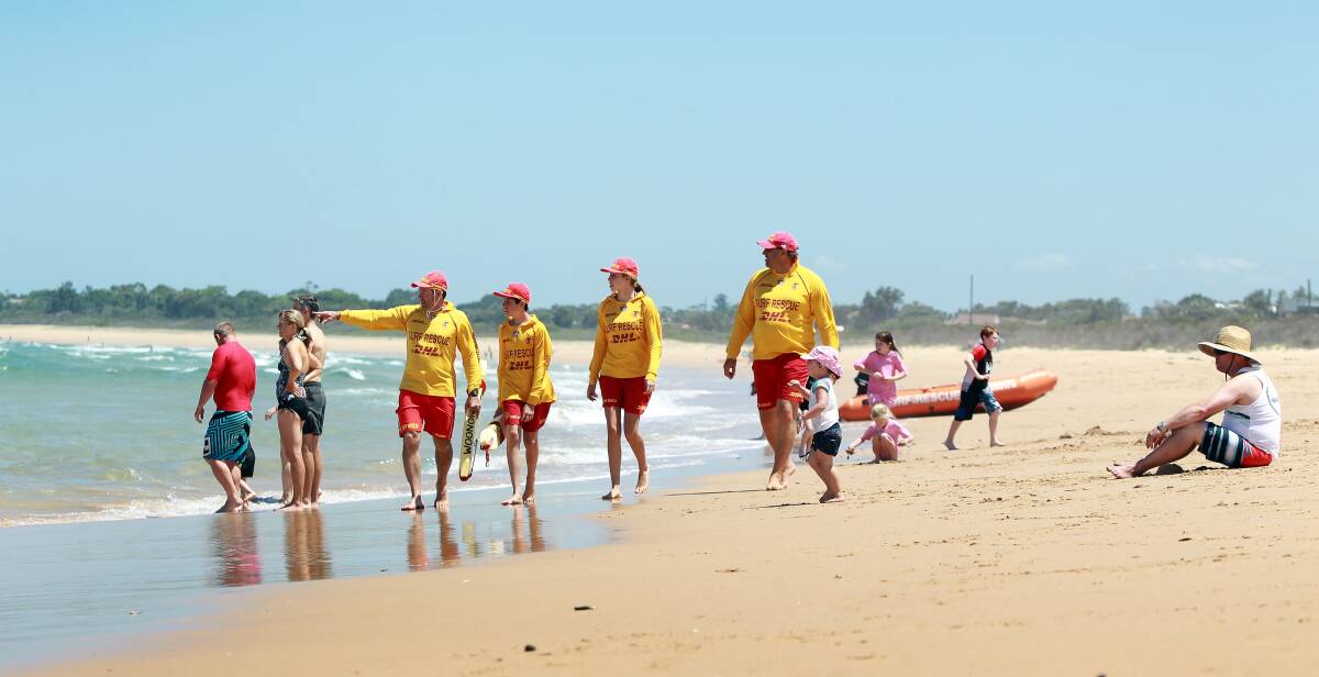 Beach patrol: Lifesavers stroll their pristine patch at Woonona Beach, which is rated "very good" in the State of the Beaches report. Picture: Sylvia Liber.