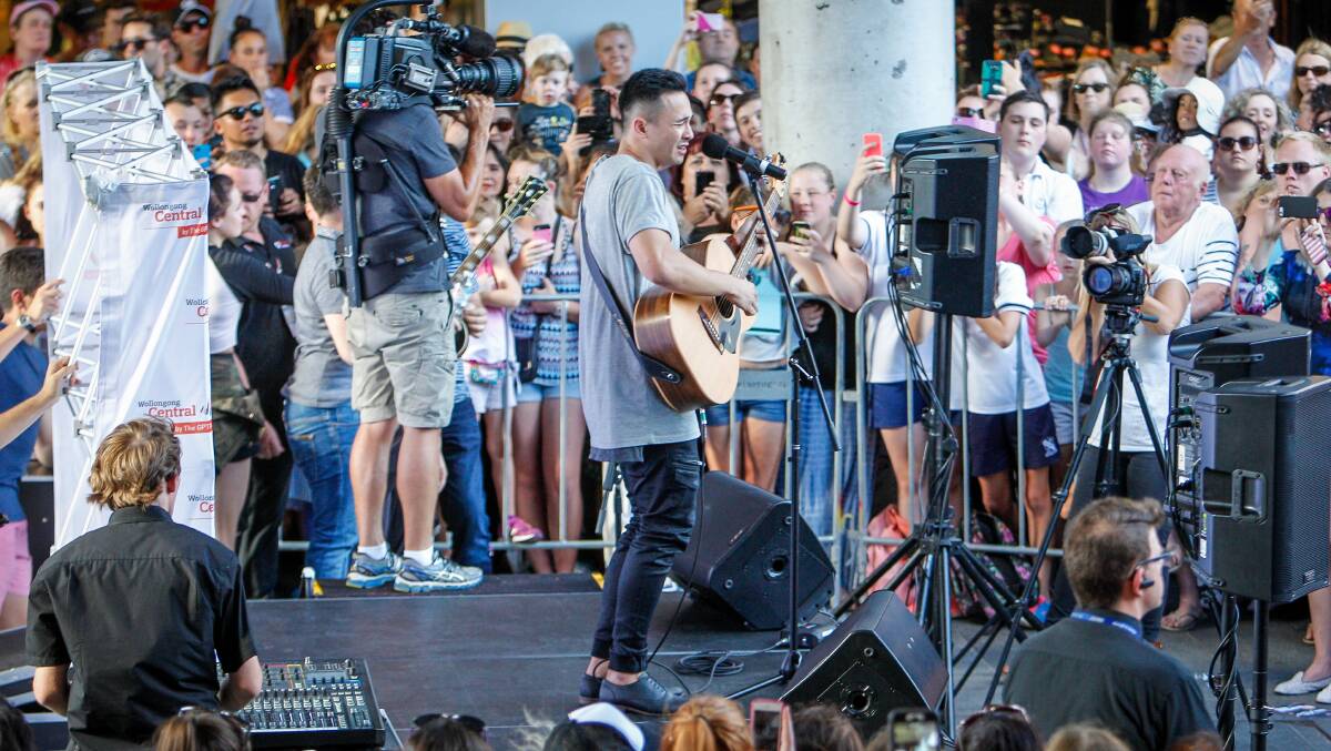 Unlocking talent: X Factor contestant Cyrus Villanueva visiting fans in Wollongong Mall during the filming of the reality television show. Picture: Adam McLean.