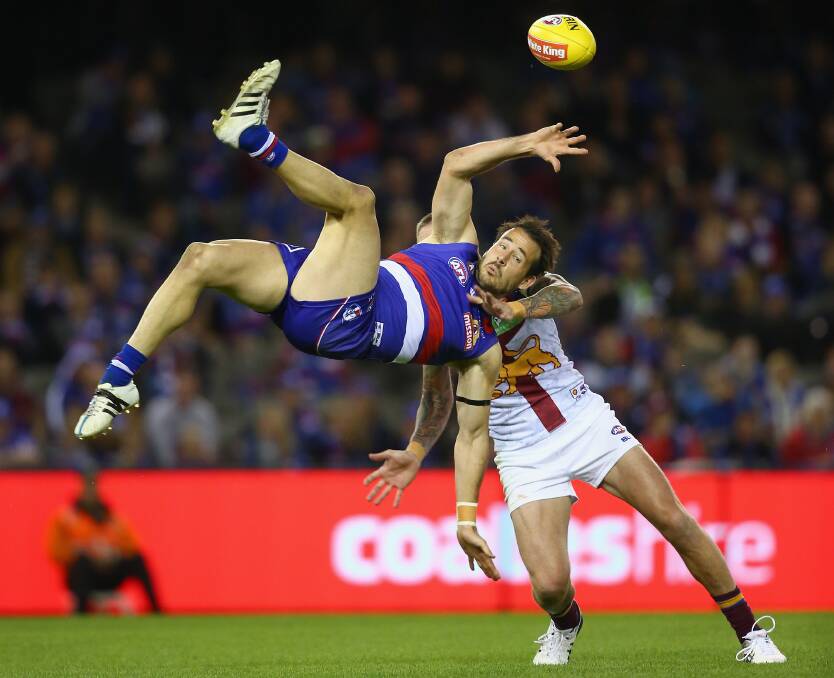 FLYING HIGH: Tory Dickson of the Bulldogs attempts to mark over the top of Claye Beams of the Lions during the round five AFL match between the Western Bulldogs and the Brisbane Lions. (Photo by Quinn Rooney/Getty Images)