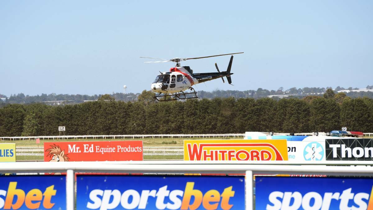 The helicopter landing at the track.