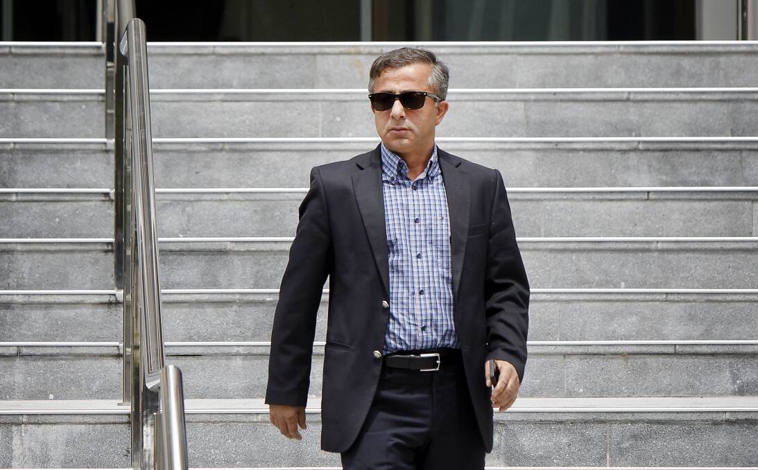 Thanks Dad: Former Wollongong councillor Zeki Esen leaves Wollongong courthouse on Wednesday after securing his son's release on bail.
