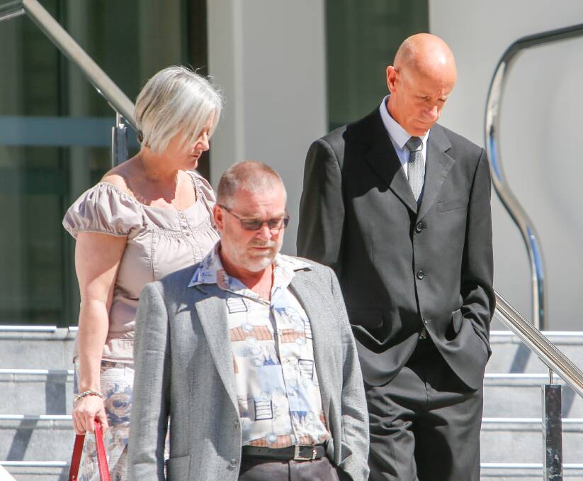 Allegations denied: David John Round (right) leaves Wollongong courthouse on Monday flanked by supporters. His trial is expected to last three days.
