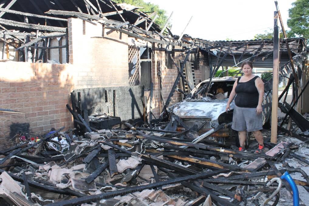 DESTRUCTION: Alex Turner at the side of her property which was destroyed by fire. Photo: Cheryl Goodenough 