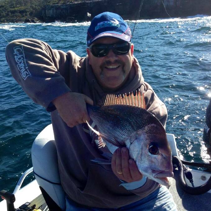 NICE CATCH: Jonno with a Jervis Bay winter time snapper caught using a floating pilchard bait.