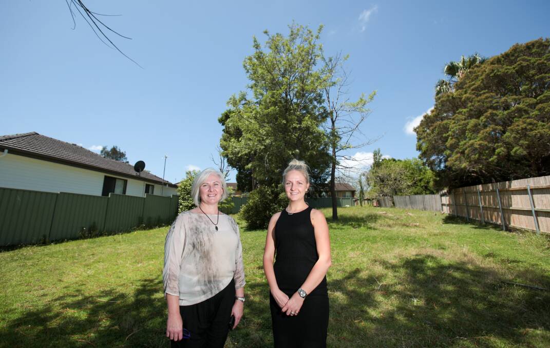 EMPOWERING: Chloe Hand and Kate Burrett stand in the vacant block at Middlesex Street in Berkeley where their new school for troubled teens is to be built. It's hoped to be completed and ready by 2017. Picture: Adam McLean
