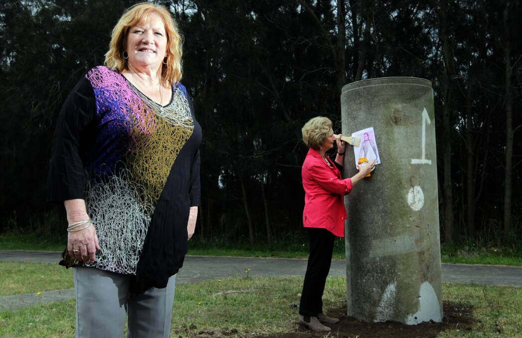 File picture from 2014: Totem Poles installed as part of Shellharbour's art trail along Lake Illawarra foreshore with mayor Marianne Saliba. Picture: Sylvia Liber