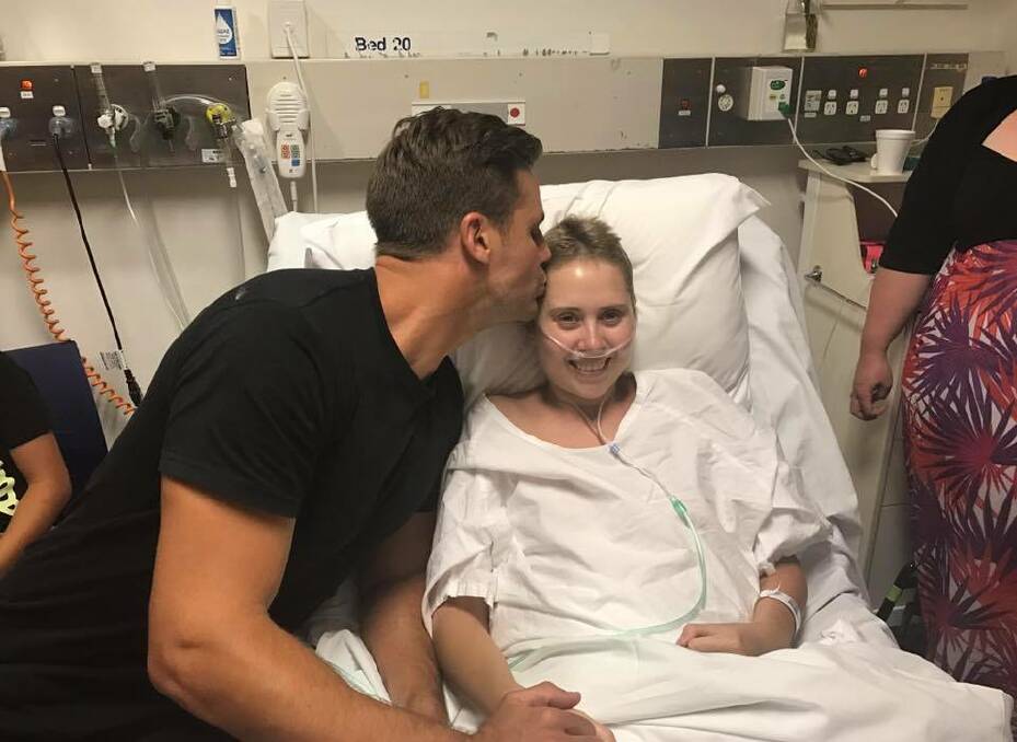 LAST WISH: Terminally ill cancer patient Kia Lettice gets a visit from former NRL star Beau Ryan on Tuesday. Picture: Facebook