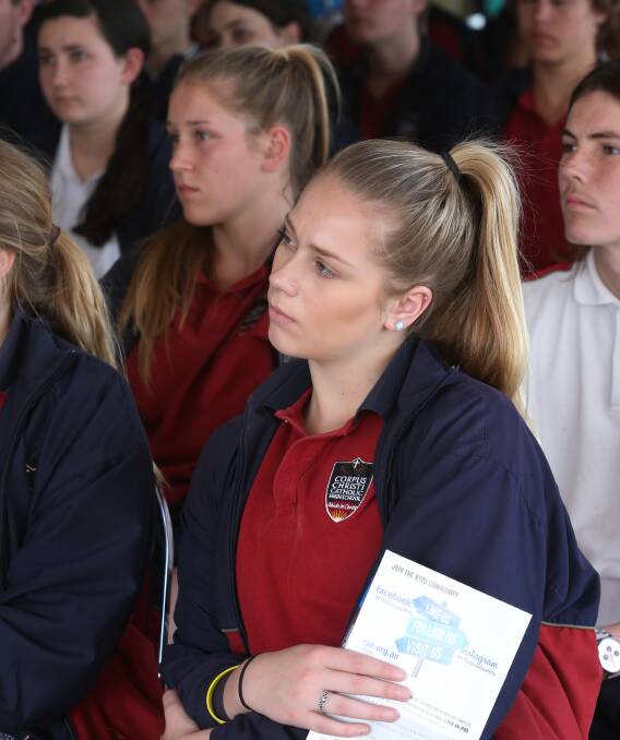 CAPTIVATED: Corpus Christi Catholic High School student Abbey Davis and classmates listening to car crash survivor Omar on Tuesday. He was left with a permanent brain injury. Picture: Robert Peet