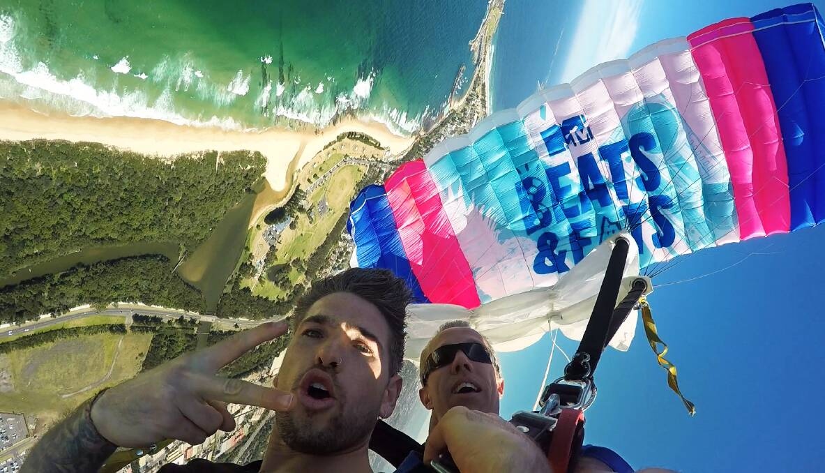 SKY HIGH: Host of the MTV Beats & Eats festival test-drives the option to arrive at Stuart Park via tandem skydive. Patrons can opt to upgrade their $30 ticket to include a skydive.