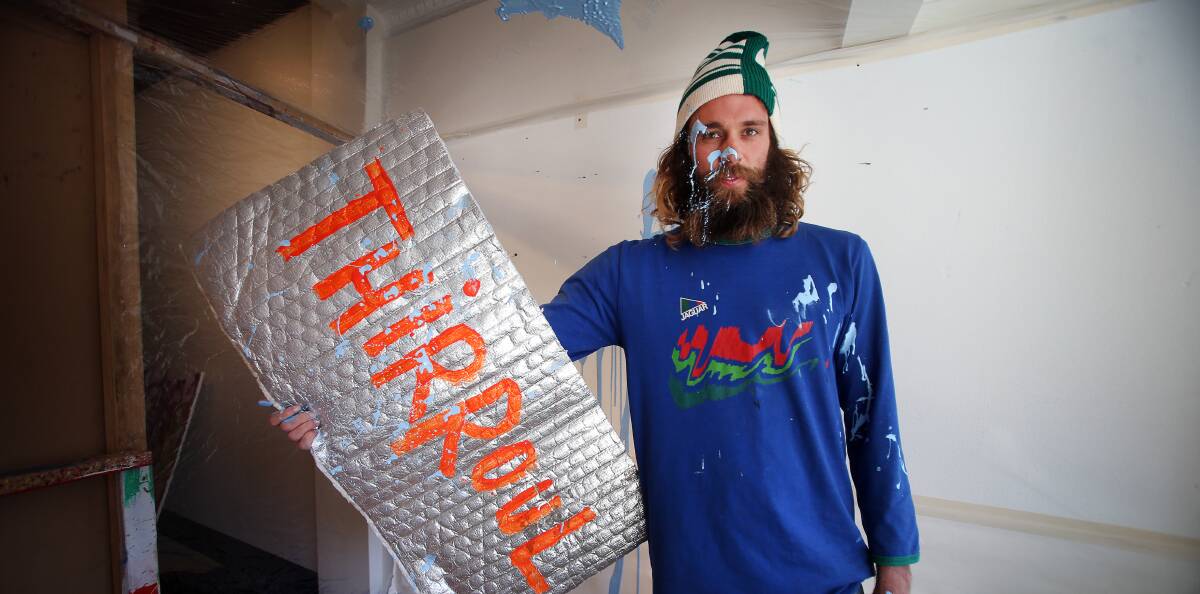 INSIDE JOCK'S BOX: Henry Jock Walker is creating art in the surf and inside the Egg & Dart Gallery in Thirroul for all to watch. Picture: Sylvia Liber