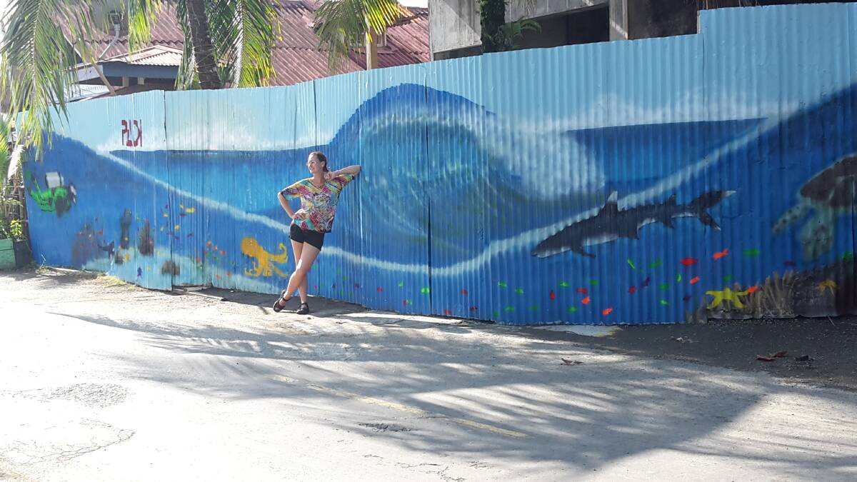 Tiffany Porter and her first commissioned mural in Panama.