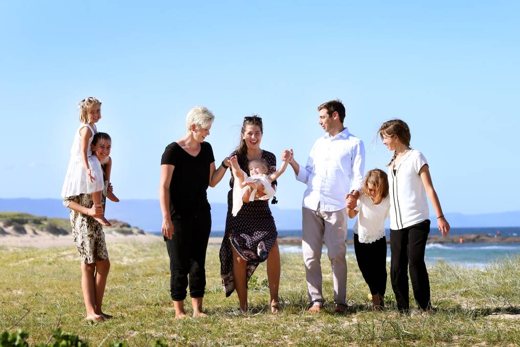 NOW: Dr Coulson, his wife Kylie and daughters Ella, Abbie, Chanel, Lilli, Annie and Emilie. Picture: Sylvia Liber