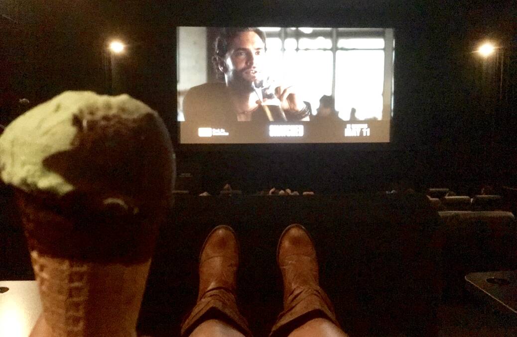 Remember the days of getting in trouble for having your feet up? Not anymore! Watching previews in my comfy chair and mint Choc Top.