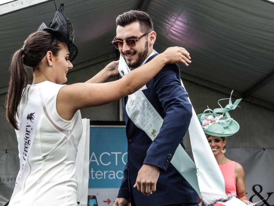 STYLISH: Winner of the men's fashions on the field, Daniel Vargareff. His tailor-made navy suit is on trend with men's racing fashion this year. Picture: Georgia Matts