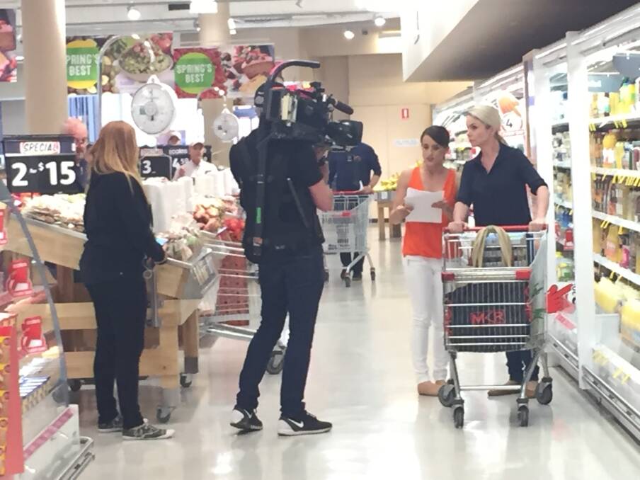 SPOTTED: Two My Kitchen Rules 2017 contestants shopping in Fairy Meadow on Thursday morning. The women grabbed eggs, sugar, sour cream and other items while a cameraman, sound man and two producers followed. Picture: Desiree Savage