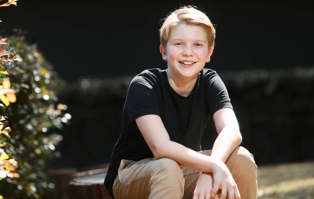Finn Bradley can tap-dance, sing and also ride a pogo stick. He's starring in the musical Miracle City at the Sydney Opera House. Picture: Adam McLean