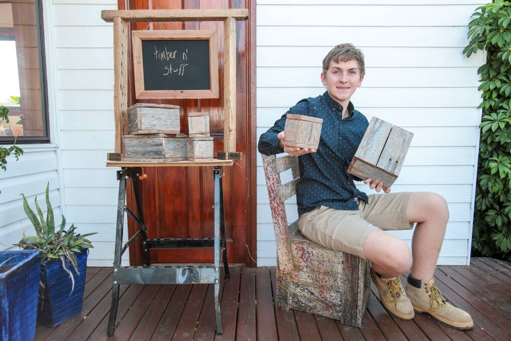 ENTREPRENEURIAL: Jordan Lukey from Unanderra will debut his Timber 'n' Stuff business at Sunday's Wild Rumpus Makers Market. He's made pieces from old fence palings to sell at market stores. Picture: Adam McLean