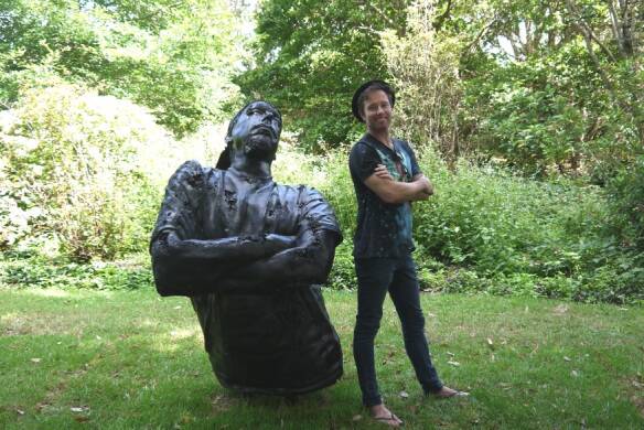 The 2016 winner of Sculpture in the Garden, Louis Pratt with his work, King Coal. Picture: Supplied