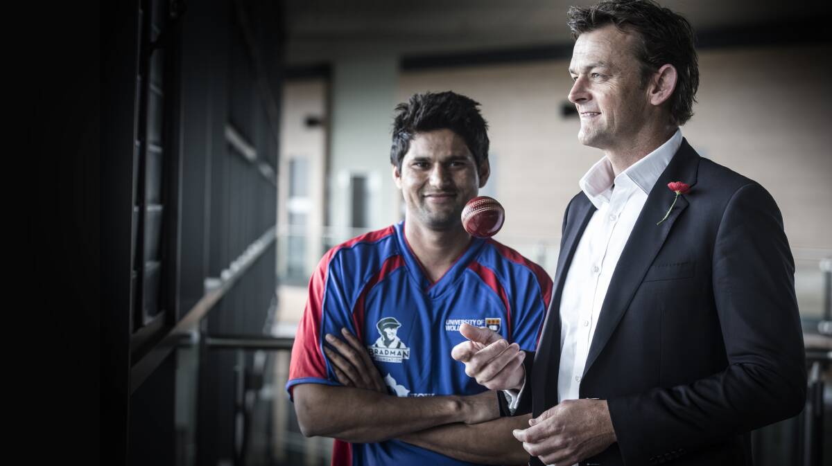 WINNING: Adam Gilchrist names Ajay Dalal as the 2015 recipient of UOW's Bradman Foundation Scholarship on Wednesday. Picture: Paul Jones