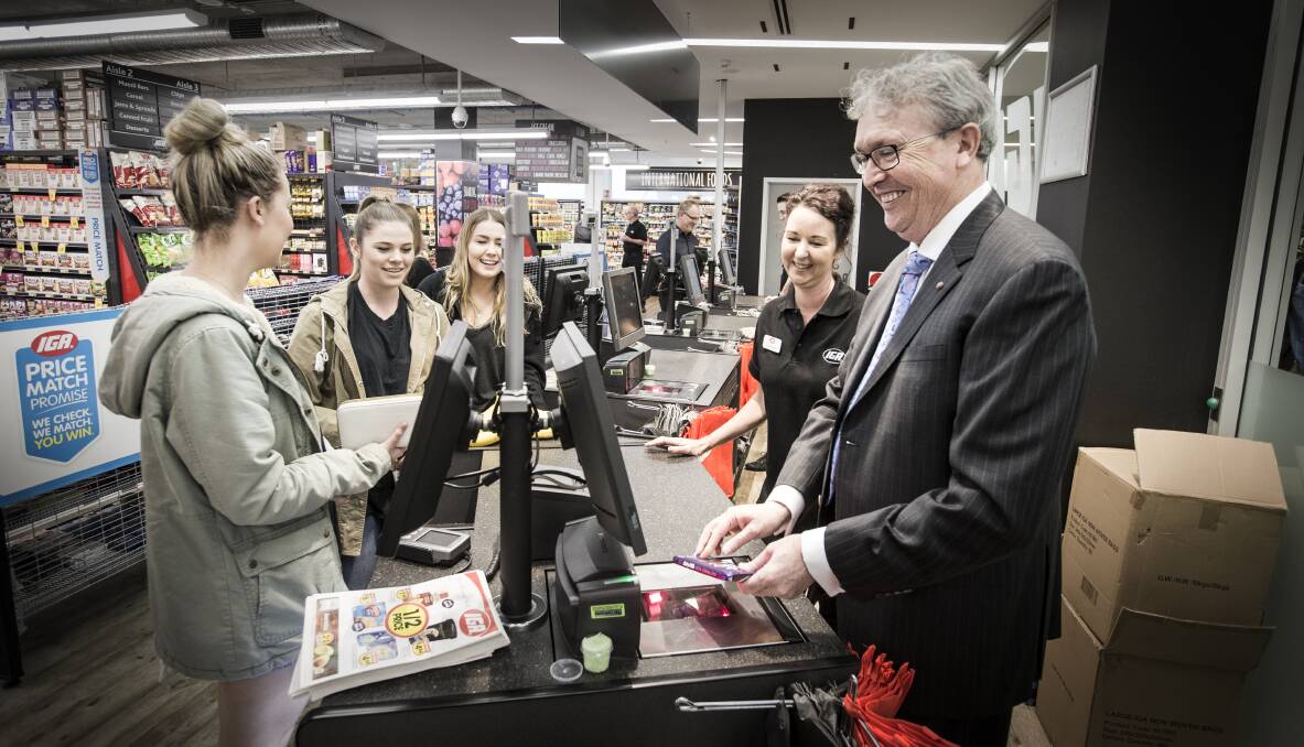 CHECK IT OUT: UOW Vice Chancellor Paul Wellings at the new IGA on campus on Wednesday. The top items sold since opening are an energy drink, sausage rolls, chocolates and strawberries. Picture: Paul Jones