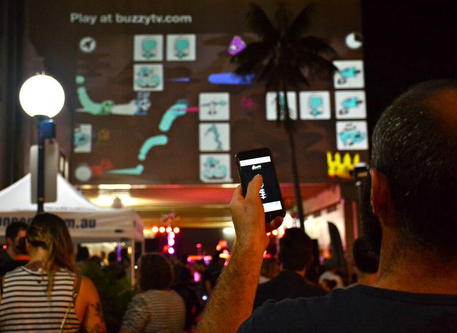 BLENDER OPENING: An interactive game developed by Thirroul's Lime Rocket and local artist Bafcat was projected on the walls of Globe Lane for all to play. Picture: DESIREE SAVAGE