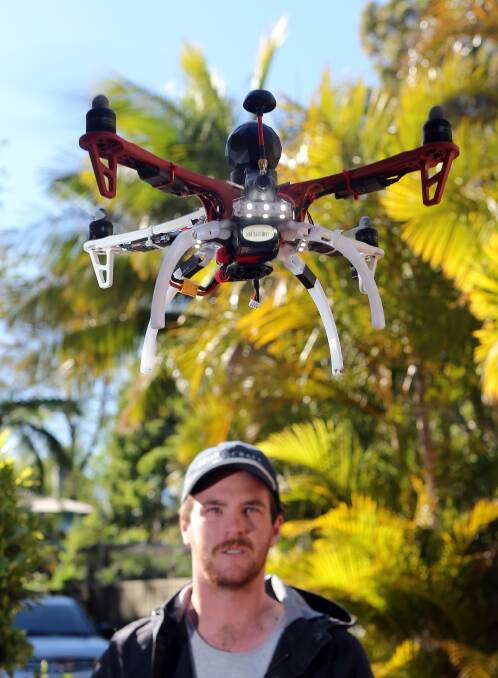 Sam Noakes piloting his surveillance drone. He's been developing a drone for the RMS to assist in surveillance of bridges. Picture: Robert Peet