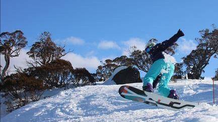 Snowboarder takes a jump at Perisher. Picture: Supplied