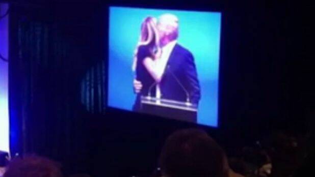 Jennifer Hawkins appears to turn her cheek as Donald Trump goes to kiss her. Photo: Supplied