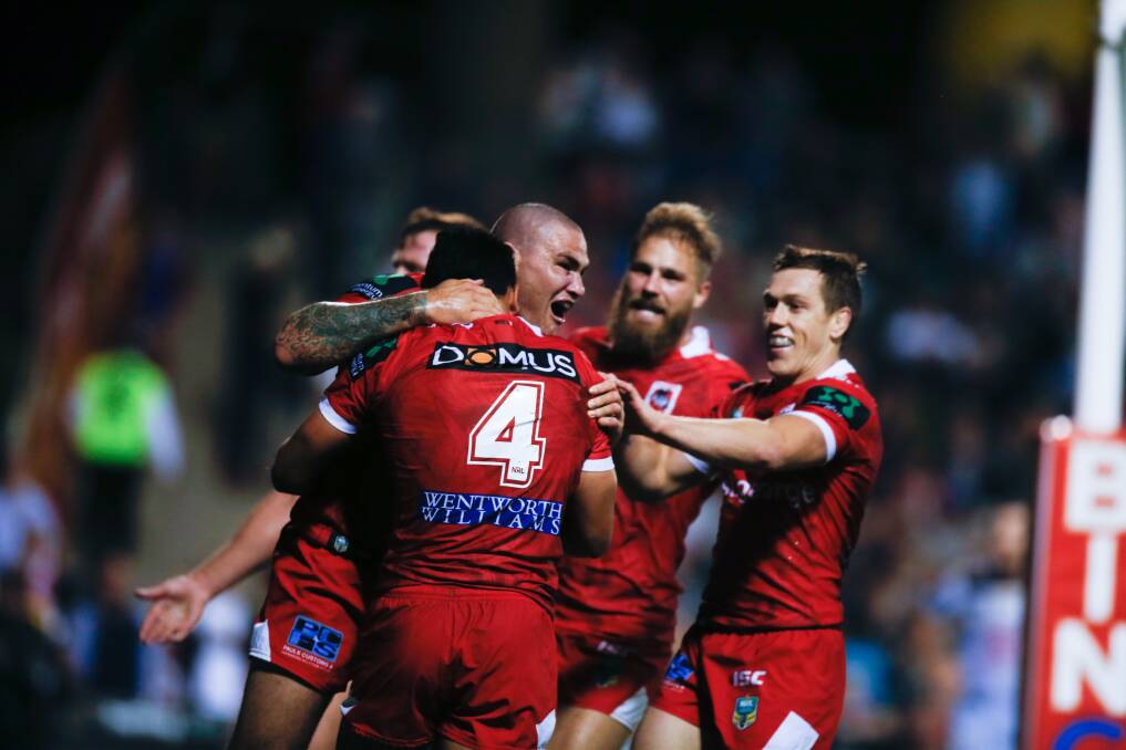 DEMOLITION JOB: The Dragons ran in five first half tries to eventually hold off the Cowboys 28-22 at WIN Stadium on Saturday night. Picture: Georgia Matts