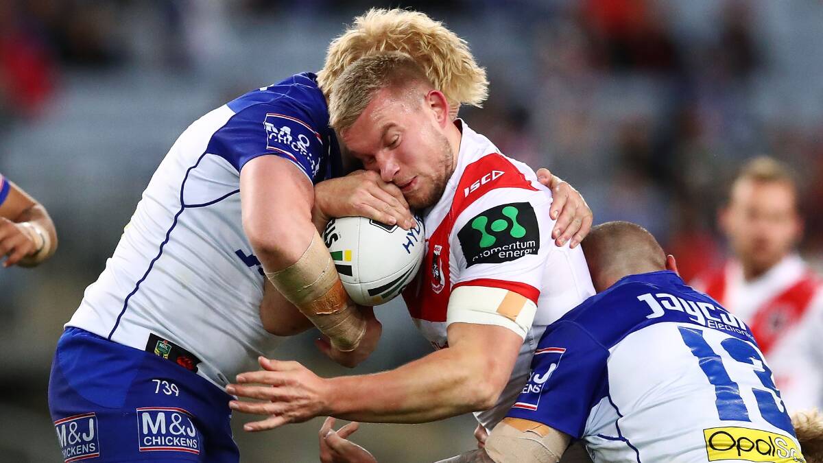 TOUGH BATTLE: Dragons forward Mike Cooper tangles with the Bulldogs defence in his side's 13-10 loss at ANZ Satdium on Friday night.