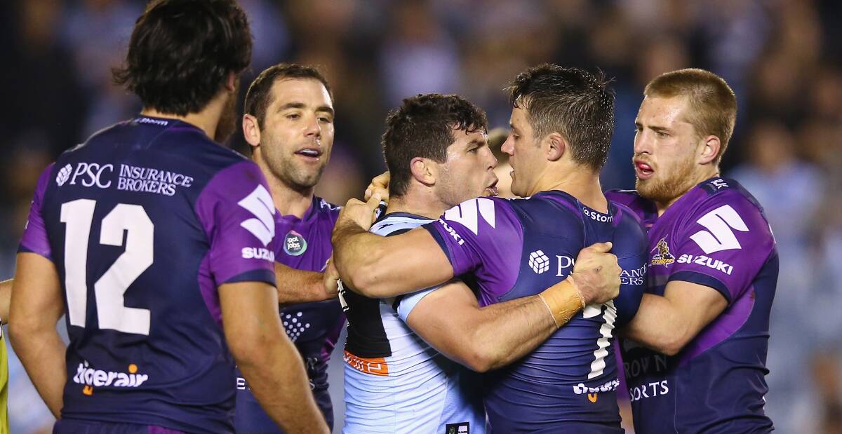 BOX SEAT: Sharks hooker Michael Ennis and Storm halfback Cooper Cronk may get to renew hostilities in the NRL grand final. Picture: Getty Images