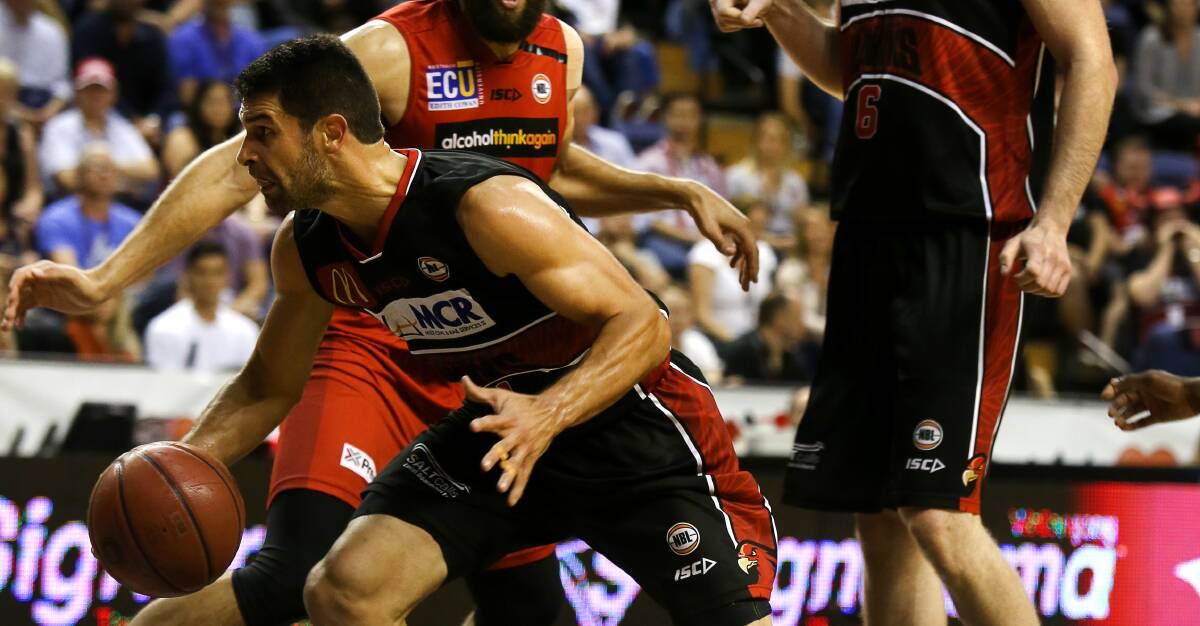 ON FIRE: Illawarra guard Kevin Lisch had 25 points and four assists but it wasn't enough to get the Hawks over the line against Perth on Wednesday. Picture: Sylvia Liber