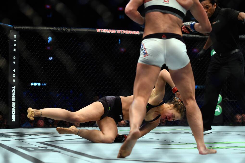 THE FALL: Ronda Rousey is felled by Holly Holm at UFC 193. Picture: Getty Images
