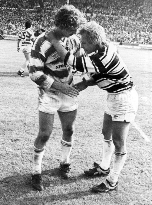 GLADIATORS: Brett Kenny and Peter Sterling embrace after the 1985 Challenge Cup Final.