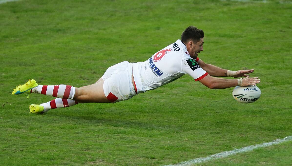 FLYING HIGH: Gareth Widdop scores the opening try in the Dragons 20-18 Anzac Day victory over the Roosters on Monday. Picture: Getty Images.