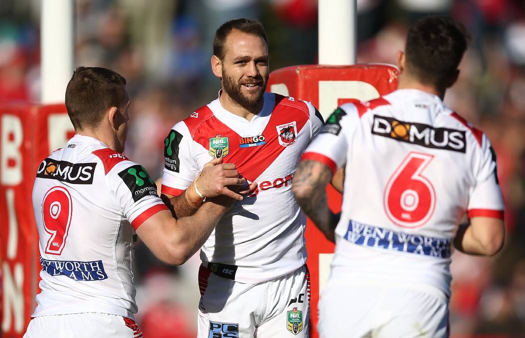 CLUBMAN: Jason Nightingale celebrates his 100th NRL try against Newcastle on Sunday. Picture: Getty Images