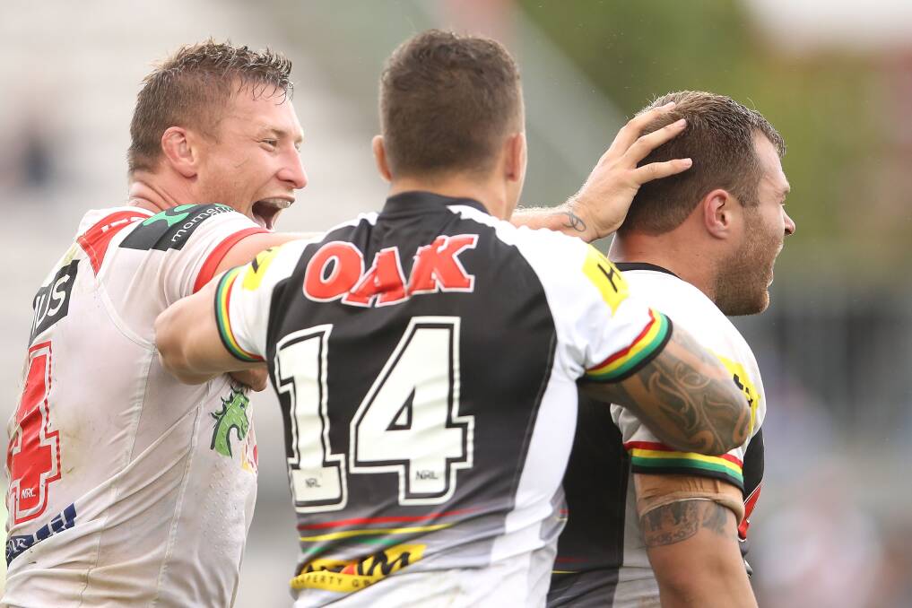 NO ANSWER: Penrith struggled with Tariq Sims and the Dragons pack in the middle of the park on Saturday. Picture: Getty Images