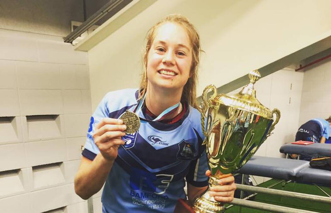 WINNING SMILE: Helensburgh star Kezie Apps was judged best on ground as NSW finally broke Queensland's 17-year stranglehold on the Nellie Doherty Cup on Saturday.