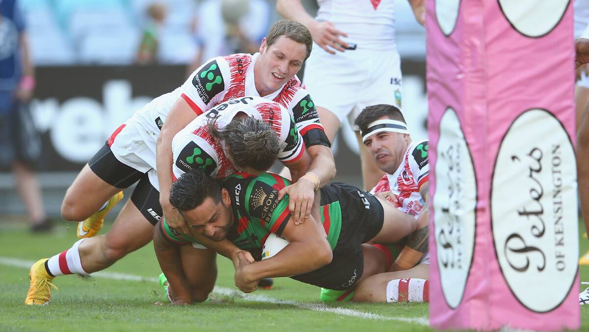 OVER: John Sutton crosses for the first try in the Rabbitohs in their 18-14 Charity Shield win over the Dragons on Saturday. Picture: Getty Images.